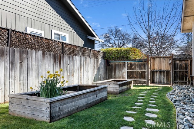 Side yard with raised planter boxes