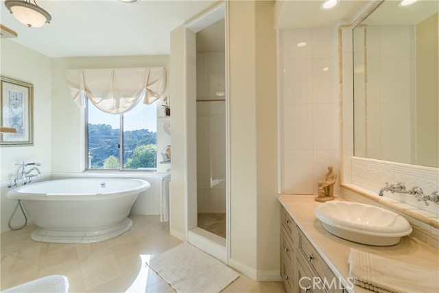 The Master Bathroom suite includes two sinks, a walk-in shower, luxurious soaking tub, and separate toilet room.