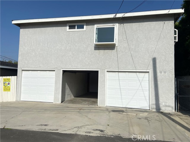 Rear of building, 3 single car garages.