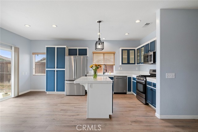 Immaculate sunny kitchen shows like a model with new stainless appliances