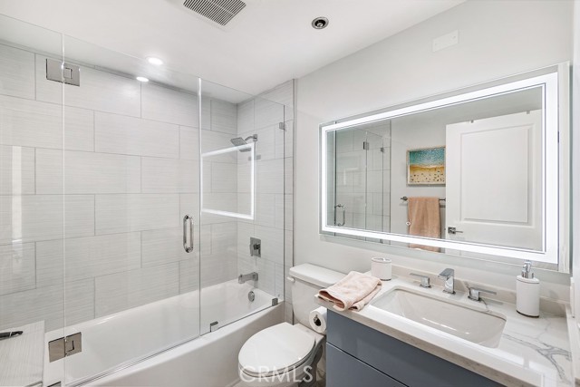 Remodeled hallway bath with LED/defrosting mirror, upgraded shower/tub combo