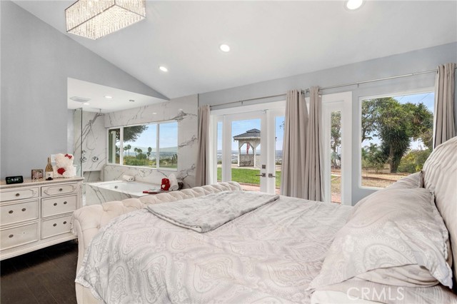 The master bedroom offers vaulted ceilings and lots of natural light.