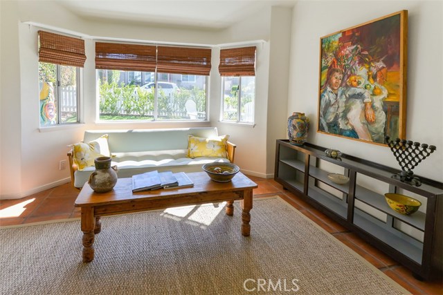 The living room with view of the yard from the bay windows.