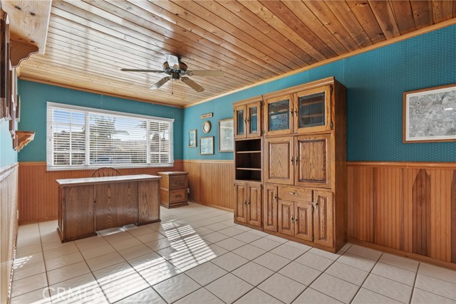 The office has tile floors, a ceiling fan and dual pane windows!
