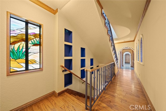 Staircase down to kitchen and family room