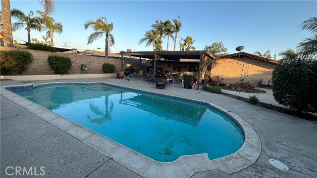 Refreshing Pool in Oversized Backyard, Hardscaped