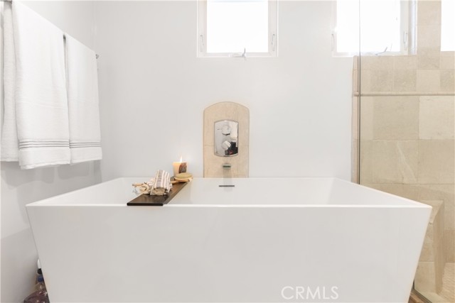 Soaking tub in primary suite bathroom