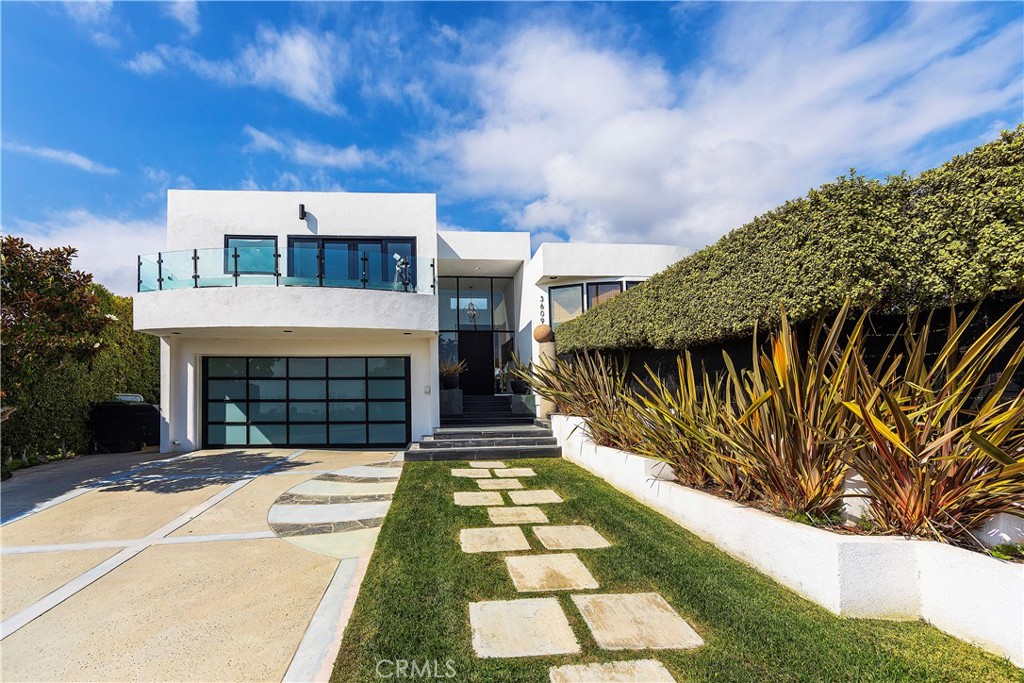 Contemporary Malibu remodeled home with forever ocean & city views.   Located in Sunset Mesa neighborhood near The Getty Villa.  Enter the home mid level with soaring ceiling through the entry to an open concept living/dining room, family room and kitchen.  Access  from family room to the lushly landscaped private yard with patio and path that wraps around to the front private gated yard.   Beautiful light and airy split level floor plan with three spacious bedrooms upstairs, two baths, while enjoying your ocean views from master suite, walk out deck & bath.  The master suite features a walk-in cedar lined closet with organizers.  The lower level has two spacious bedrooms and one full bath, or a one bedroom and a office/bedroom/gym.  This home can be 4 bedroom, plus and office or 5 bedroom home.  One of the lower bedrooms has access to the back yard.  Minutes away from famous Malibu beaches, The Getty Villa, Palisades Village, Pepperdine University and the Santa Monica Mountain hiking trails, restaurants and shopping on famed Montana Ave..  This home will certainly exceed your expectations!