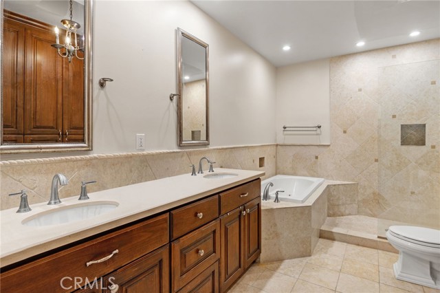 Primary Bathroom with full tub and large walk-in shower