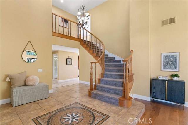 The sweeping curved staircase leads you upstairs to 4 bedrooms