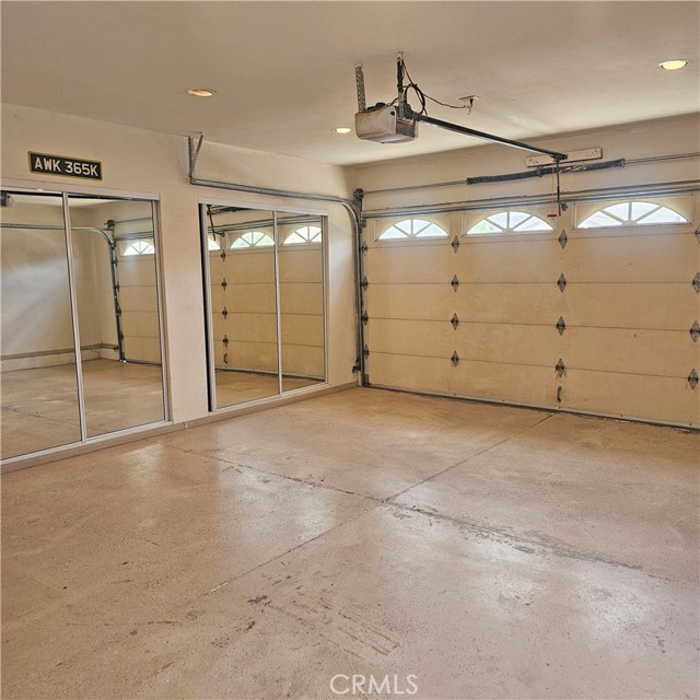 Mirrored closets in air-conditioned garage for gym use with ample storage