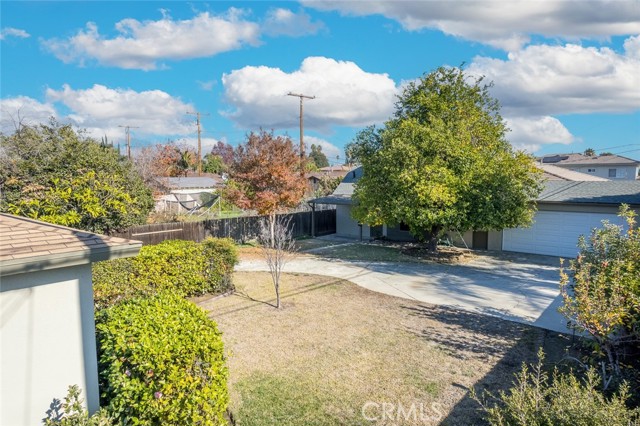 View to back 3rd unit. Large driveway, 2 car garage and big private yard.