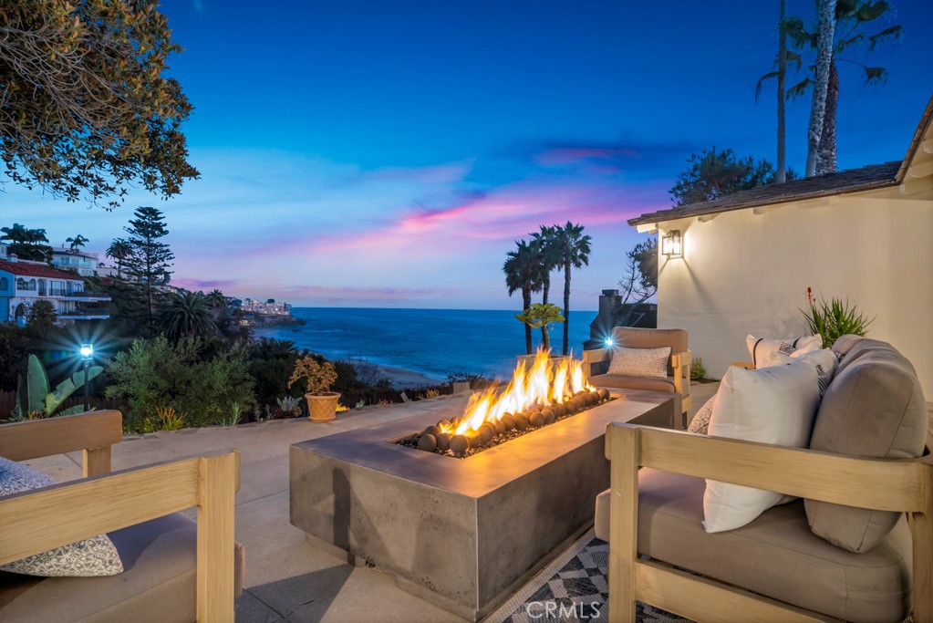 Welcome to Paradise! Enjoy quintessential beach living on one of the most coveted lots Laguna Beach has to offer! Featuring two quintessential Laguna Beach homes on a massive dreamy 11,050 SF lot with spectacular ocean views and direct beach access. Get lost in the lush newly landscaped lot featuring numerous entertainment areas with breathtaking ocean views throughout. Reimagined by renowned designer Nate Fischer, often seen on TV, to preserve the beachy authentic splendor while also modernizing the homes with the finest finishes. The first home is 1,970 SF with 3 spacious bedrooms, 2 exquisite chic bathrooms, including a floating bathtub, bidet toilets and the highest-end finishes. The entire living room opens to jaw dropping ocean views serenaded by magical ocean waves. The home is complete with a gourmet kitchen featuring new Viking Appliances, a washer dryer room, and a stunning dining room with stunning ocean views! The two-story second home is perfect to complete this enchanting property featuring 2 bedrooms, 3 baths, an office and a massive entertainment room / mancave! The upper floor boasts a spacious living room with ocean views, an adorable kitchen featuring Viking Appliances and a massive bedroom, again with ocean views! The lower level enjoys an adorable office, a bathroom and a massive entertainment room complete with a kitchenette with a built-in microwave, 36 inch fridge, plenty of storage and washer dryer hookups. The home also includes brand new garage doors, security cameras, exterior lighting, windows, & doors. Also enjoy a breathtaking brand new 36 jet Jacuzzi with ocean views! This coveted property is in a gated community with only 10 homes while not requiring any HOA fees. The street offers plenty of private parking as well. The remodel was permitted. In addition, plans to expand the first floor and add a beautiful second story to the main home and a stunning infinity pool have already been city approved! Run, don't walk to enjoy coastal living at its finest! Make sure to see the stunning video below or at 10CamelPoint.com! Must see to believe! Welcome to Paradise! Enjoy quintessential beach living on one of the most coveted lots Laguna Beach has to offer! Featuring two quintessential Laguna Beach homes on a massive dreamy 11,050 SF lot with spectacular ocean views and direct beach access. Get lost in the lush newly landscaped lot featuring numerous entertainment areas with breathtaking ocean views throughout. Reimagined by renowned designer Nate Fischer, often seen on TV, to preserve the beachy authentic splendor while also modernizing the homes with the finest finishes. The first home is 1,970 SF with 3 spacious bedrooms, 2 exquisite chic bathrooms, including a floating bathtub, bidet toilets and the highest-end finishes. The entire living room opens to jaw dropping ocean views serenaded by magical ocean waves. The home is complete with a gourmet kitchen featuring new Viking Appliances, a washer dryer room, and a stunning dining room with stunning ocean views! The two-story second home is perfect to complete this enchanting property featuring 2 bedrooms, 3 baths, an office and a massive entertainment room / mancave! The upper floor boasts a spacious living room with ocean views, an adorable kitchen featuring Viking Appliances and a massive bedroom, again with ocean views! The lower level enjoys an adorable office, a bathroom and a massive entertainment room complete with a kitchenette with a built-in microwave, 36 inch fridge, plenty of storage and washer dryer hookups. The home also includes brand new garage doors, security cameras, exterior lighting, windows, & doors. Also enjoy a breathtaking brand new 36 jet Jacuzzi with ocean views! This coveted property is in a gated community with only 10 homes while not requiring any HOA fees. The street offers plenty of private parking as well. The remodel was permitted. In addition, plans to expand the first floor and add a beautiful second story to the main home and a stunning infinity pool have already been city approved! Run, don't walk to enjoy coastal living at its finest! Make sure to see the stunning video below or at 10CamelPoint.com! Must see to believe!