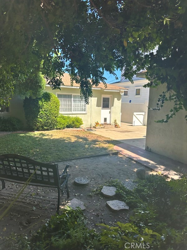 There is a Rear Entry Door to the House from the Rear Yard and The Garage
