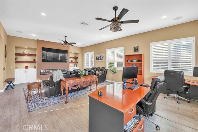 Alternate view of family room with custom fireplace