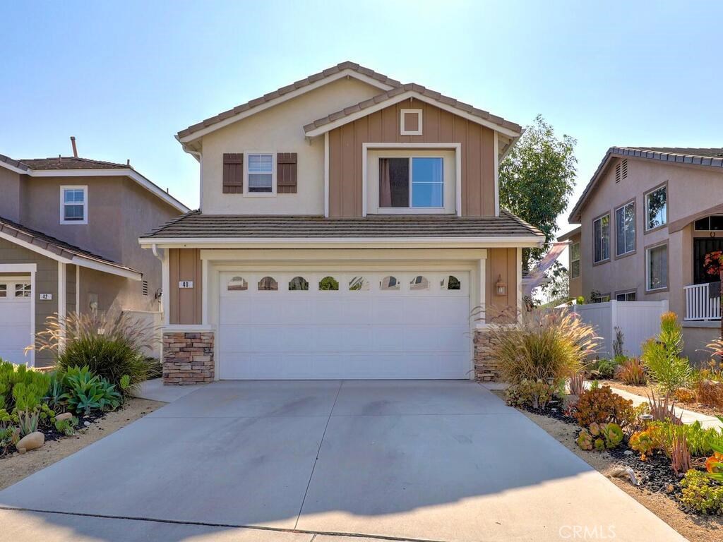 Warm and charming home with 3 bedrooms, 2.5 baths. High ceilings give a sense of space and grandeur with lots of windows to bring the natural light in. Updated kitchen with state of the art stove and stainless appliances, highlighted with quartz countertops and white painted cabinets. Open floor plan with dining ell large enough for a big table just off the living room with fireplace. Upstairs has a large master bedroom with a view of the trees. Master suite offers a private bath and good closet space. The other two bedrooms are adjoined with a Jack and Jill bathroom.  This home has many great features including a whole house water purifying system! Enjoy relaxing or spending time with family under the covered patio and backyard that faces the greenbelt.  Located in the highly sought neighborhood of Wagon Wheel this home boasts having that "out of the way" feel but yet is close to award winning schools, parks, trails, shops and restaurants close by, and the 241 Corridor that put Irvine, the airport or the beaches at your fingertips. Love where you live just took on a whole new meaning!! Take the tour! https://tours.houzzpix.com/client2/panel2#/tours/1715975/video