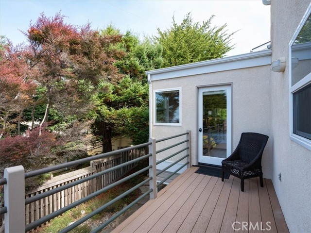 The primary bedroom shares a deck with living room.