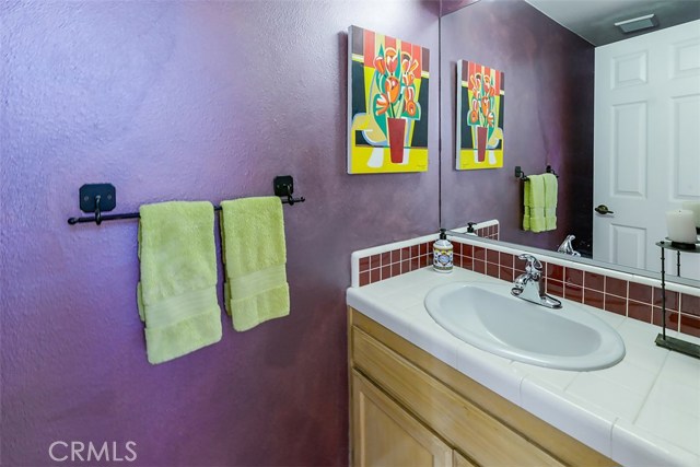 The half bathroom in the hallway between living room and family room.