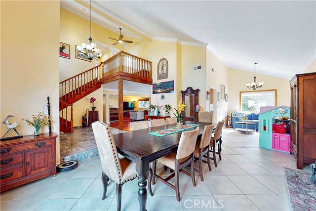 Large Living room with vaulted ceilings, seller put a large dining table there