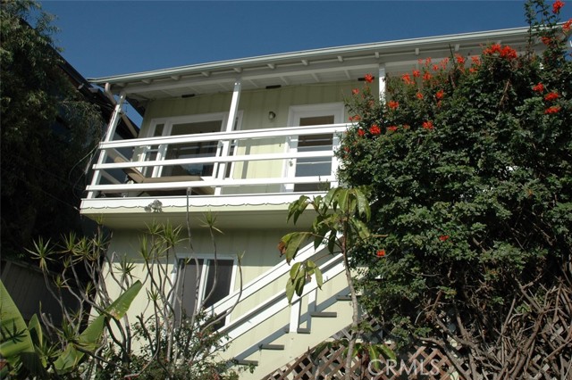 This stairway leads to the top 2 bedroom/1bath unit with panoramic views and 2 balconies.