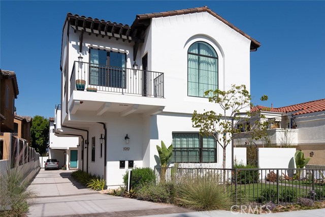 1919 Gates Avenue B Redondo Beach, California This contemporary Spanish home is the perfect blend of family friendly and entertainers dream. The attention to detail throughout has created a perfect blend of functionality and striking beauty. 7 1/2” Maple planked flooring, custom face framed maple shaker cabinets, Cambria quartz and smart home features are only a few of the top quality finishes that you will find within this home. Upon entry, the first floor features two large bedrooms connected by a Hollywood bathroom, a separate bedroom/ office with a stone shower and a separate laundry room. The backyard features a deck, turf and ample garden area offering a perfect private retreat. Asend the staircase to a stunning open concept chef’s kitchen equipped with Bosh appliances, a five burner Bartazzoni range, and a wine refrigerator. Arched windows and cathedral ceilings showcase the dining area and living room where exposed beams add dramatic effect. Two well appointed tiled patios are featured off the second floor. The master retreat boasts a fireplace, large walking closet, spa bathroom, rain shower and bonus office nook. Amazing roof deck with 360 degree views from Malibu to Hollywood. Must see.