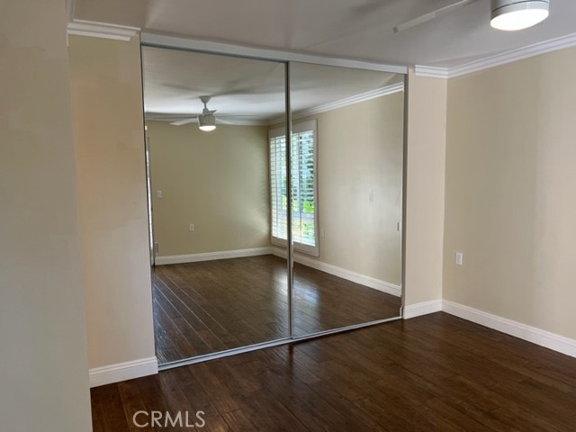 Primary bedroom has a huge mirrored closet.