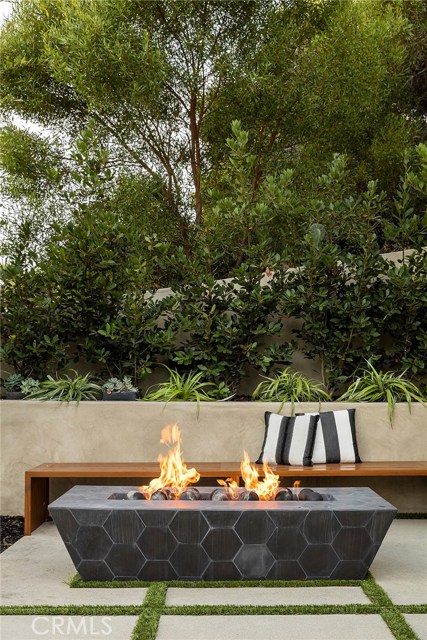 Rear turf bench and fire pit - watch movies on the wall