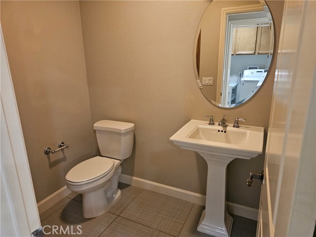 Bathroom located off the kitchen area.