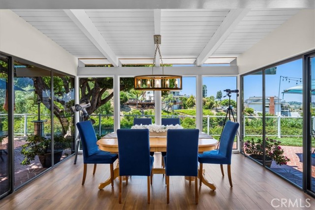 Dining room with floor-to-ceiling windows looking over the canyon and harbor view!