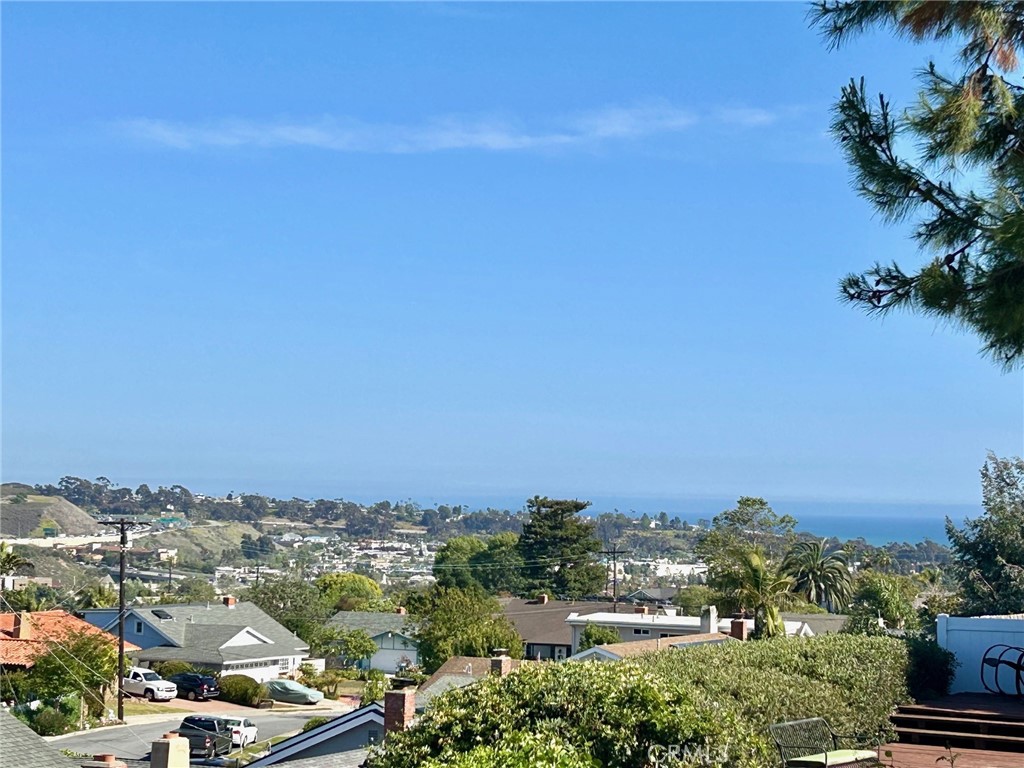 Here is a home that has it ALL!  Ocean views, pool, 4 bedrooms + 3 bathrooms, RV/Boat parking, new landscaping and hardscaping, large deck and also a flat backyard for entertaining, custom home and no association! Just updated with new roof, new kitchen, new bathrooms, new flooring, new surfaces, new windows, new air conditioning, new almost everything! Located in a desirable area of Dana Point, within close proximity of vibrant San Juan dining district, this custom home was just recently upgraded entirely. Welcome home to a home with stunning curb appeal. The home has 3 spacious bedrooms and 2 remodeled bathrooms on the first level. Upstairs, you have the WOW factor with a large family room, completely new kitchen with a large island, a cozy living room with a fireplace and a an additional bedroom with a bathroom. Professionally upgraded with designer input and vision, this home is architecturally inclined. Vast panoramic views and great ocean views await you in this modern home.
