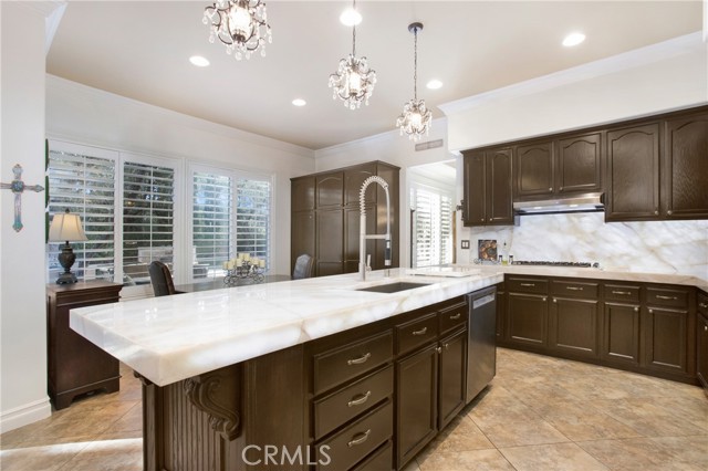 Newly renovated kitchen features quartz countertops with unique led lighting