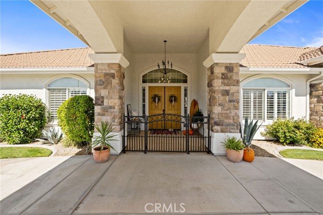 Iron gates enclose front area courtyard