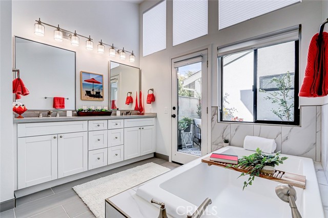 Light & bright updated primary bathroom with soaking tub