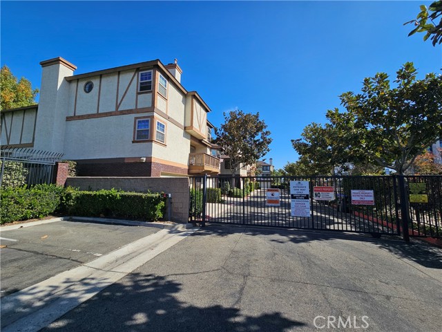 Welcome to your dream home! This bright and airy 4 bedroom, 3 bathroom townhouse located in the gated community of Acacia Park offers a panoramic view of Village Green Park! The home was well maintained over the years and recently upgraded to a modern kitchen that features brand new cabinets, quartz countertop, stainless sink, range, dishwasher, and microwave, while fresh paint downstairs creates a warm and inviting atmosphere. The open living room is complete with a fireplace and adjacent is a dining room with shutter windows. The main level also features a bedroom, full bathroom, and access to the two car garage. Upstairs includes a primary suite with walk-in-closet, bathroom, and an amazing view of the park.  There are also two additional bedrooms, a full bathroom, and a convenient laundry room.  The association includes a community pool, spa, clubhouse and ample guest parking. Enjoy the convenience of being within distance to the Garden Grove main library, coffee shops and fantastic restaurants down historic Main Street.  This prime location is also a short distance to the 22 and 5 freeways, the beach, and amusement park!