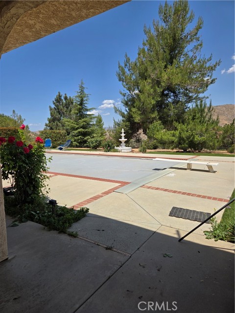 back patio with covered pool. facing southwest