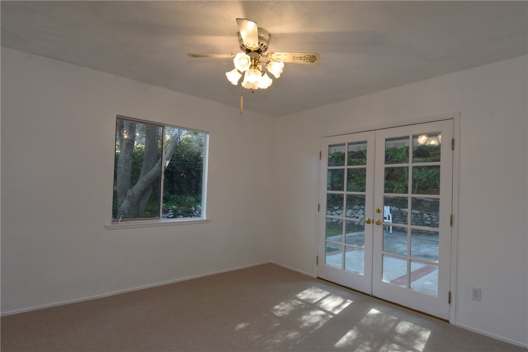 Another view of Bedroom #1 with French doors leading to the rear yard/ patio