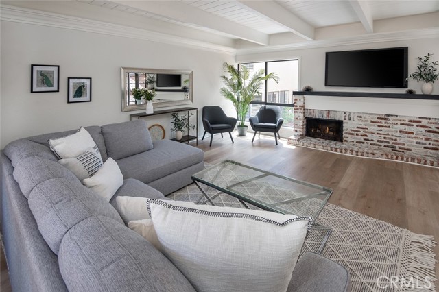 Impressive millwork, crown molding and beam ceiling in the living area.