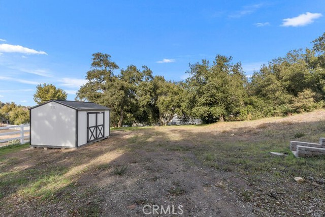 Lower level with separate gated entrance. Ideal for barn, ADU or Workshop. Staircase up to the main residence.