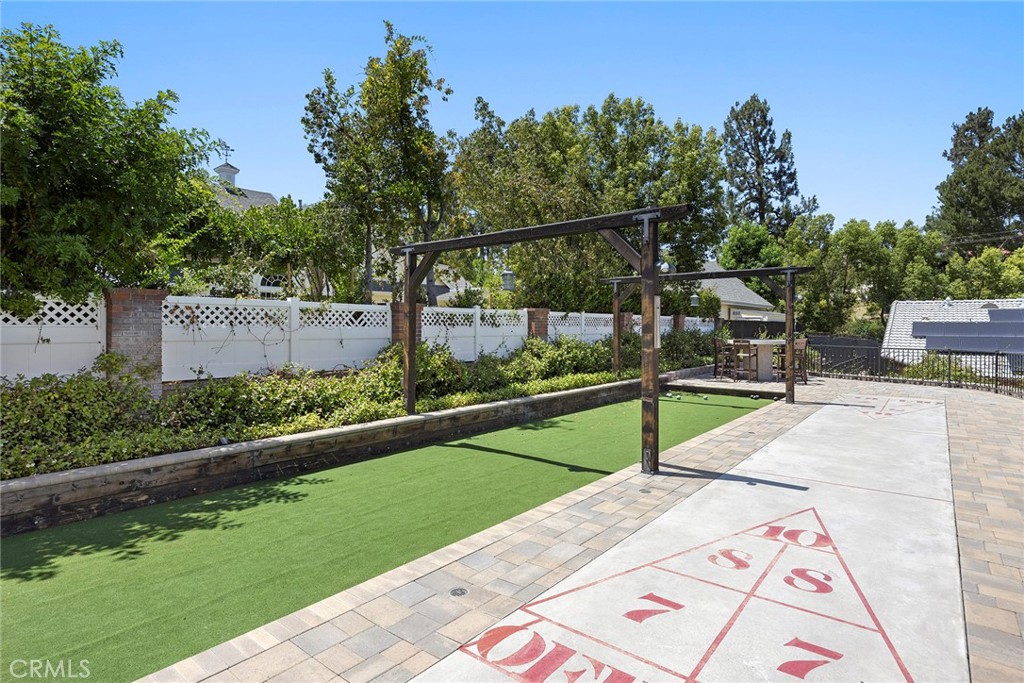 Bocca ball and shuffle board with double built-in bar height fire pits. More enjoyment for family fun, or pool parties