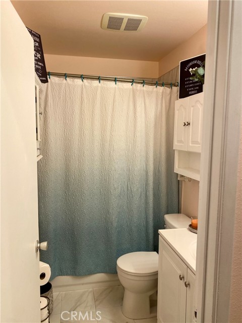 Bathroom #1 with tub, shower, toilet and sink.