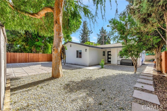 Newly built modern ADU with separate gate, walkway, and house number