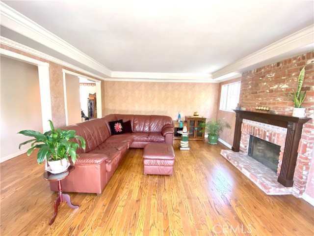 Crown molding, upscale door casing, floor molding, and coffered ceilings add some finesse to the charming but modest Great room.