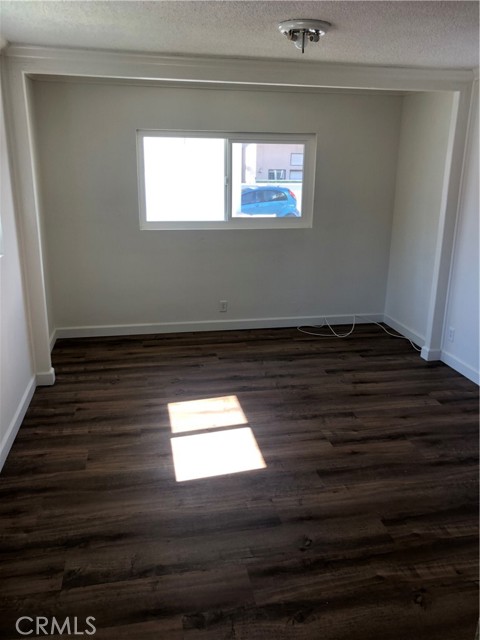 larger bedroom with closet doors removed