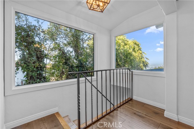 The stairwell to the entry for the private Primary Suite.