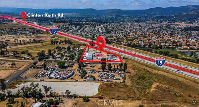 MSC ZONING!!! Located on the 15 FWY between Wildomar Trail and Clinton Keith with 600’ +/- of Freeway Frontage. Approx 9000 sqft of building space and 1600 sqft of remodeled office space. All flat and usable fully fenced 3+ acres with income producing tenants. Property is on well and septic.