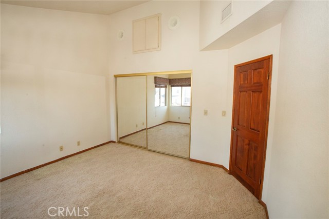 Bedroom #2: Vaulted ceiling, mirror closet doors