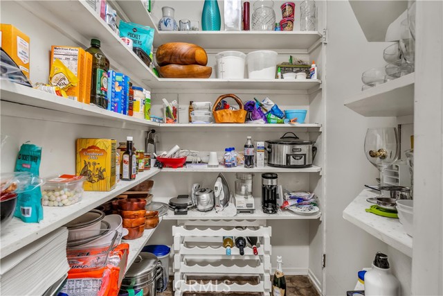 Walk-in pantry adjacent to the kitchen