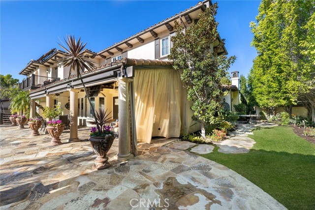 Reverse view of the outdoor living room and side yard.