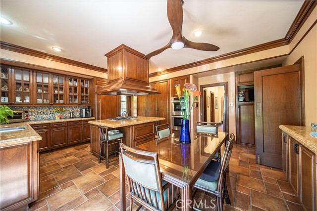 Oversize kitchen showcases beautiful walnut cabinetry