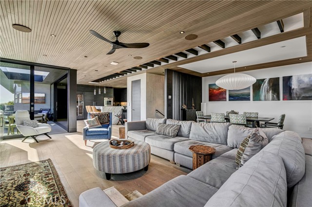 Living room looking toward ocean view deck, dining room & kitchen